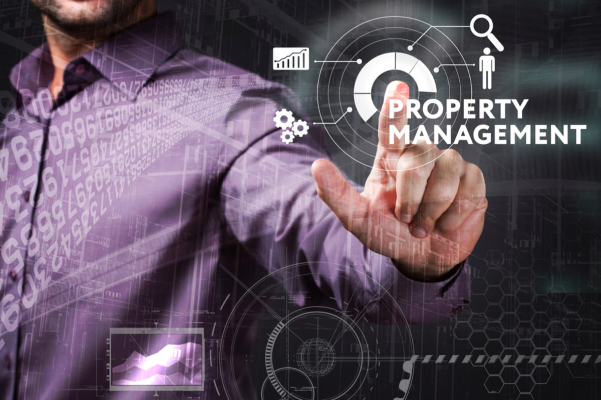 A man pointing at an icon that says property management with different symbols around it