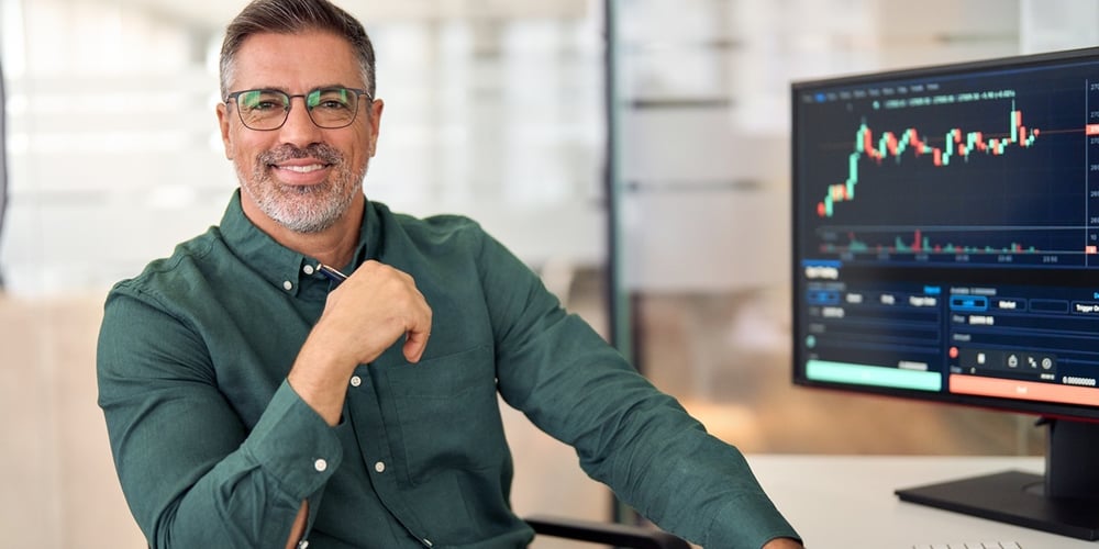 An accredited investor sitting at his desk
