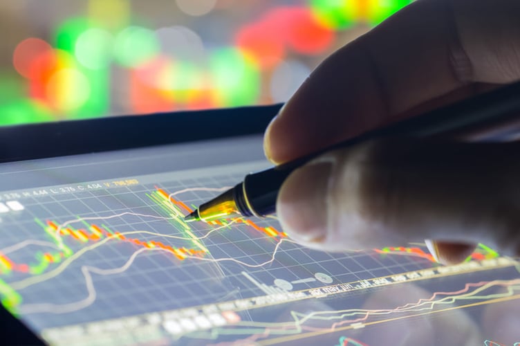 looking at economic data on a tablet