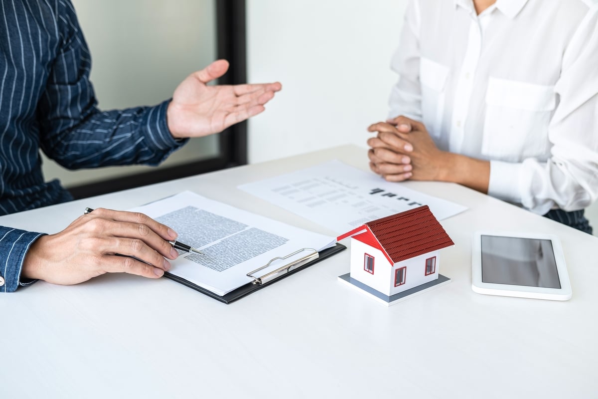 Someone meeting with a real estate professional