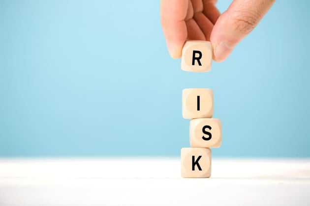 Wood blocks that spell out risk
