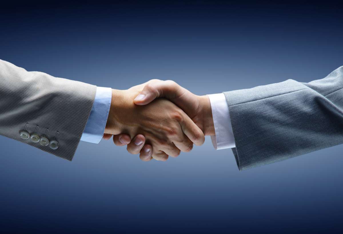 Handshake - Hand holding on black background (R) (S)