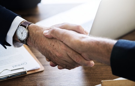 hand-shake-hands-watch-desk