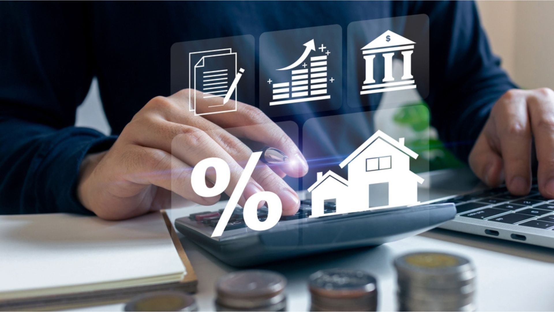 Businessman using calculator to calculate the bank interest rate for real estate