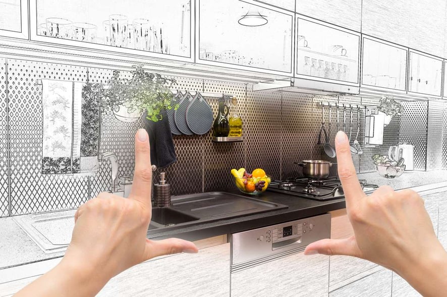 Female hands framing custom kitchen design