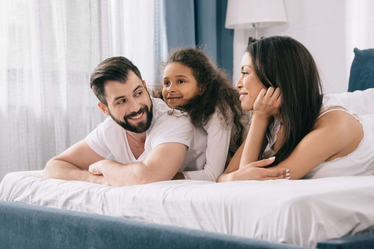Happy family in bedroom