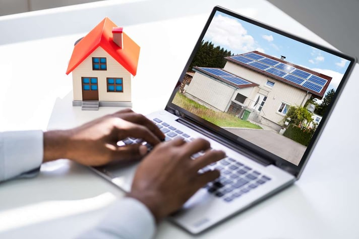 Looking Real Estate Home Or House On Laptop Computer