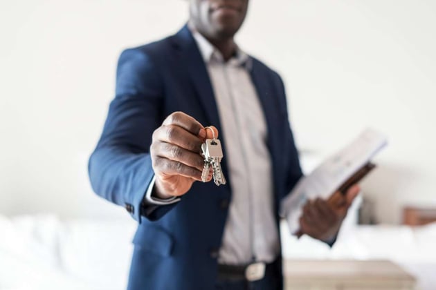 Real estate broker hands keys to turnkey investment properties