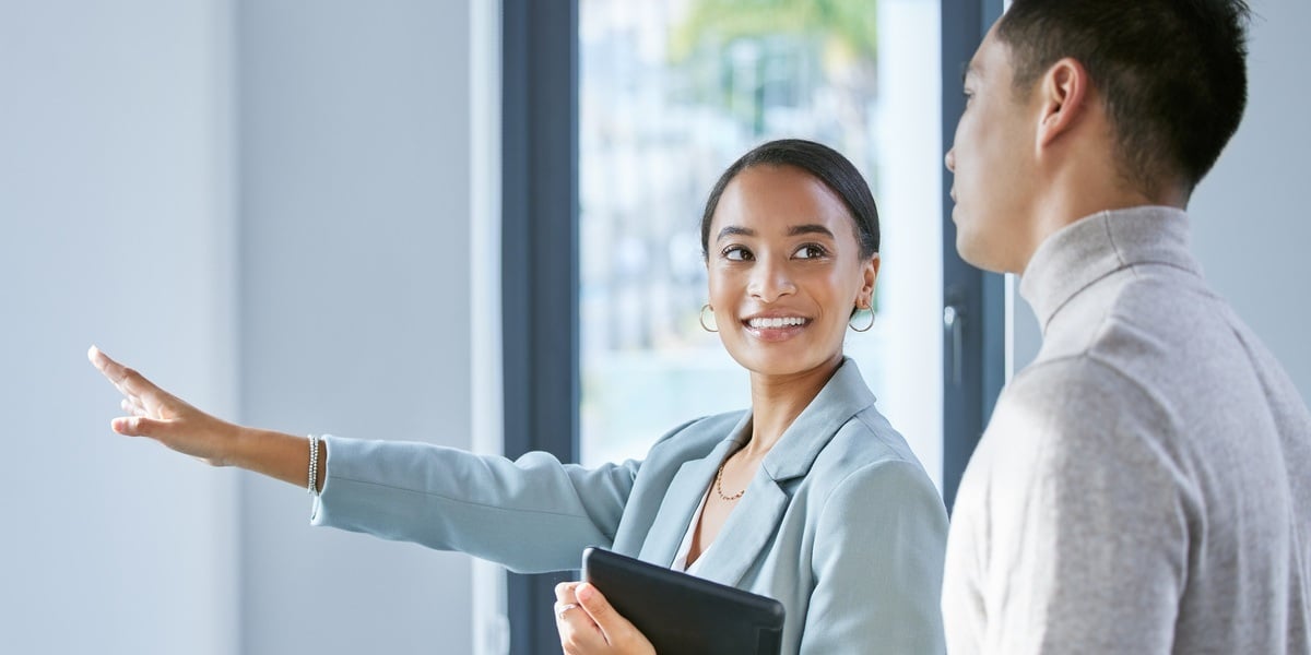 A professional woman meeting with a potential tenant