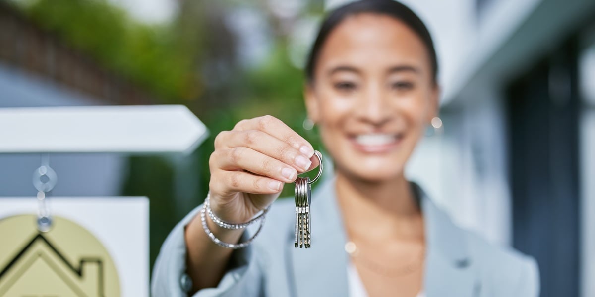 A real estate agent holding keys