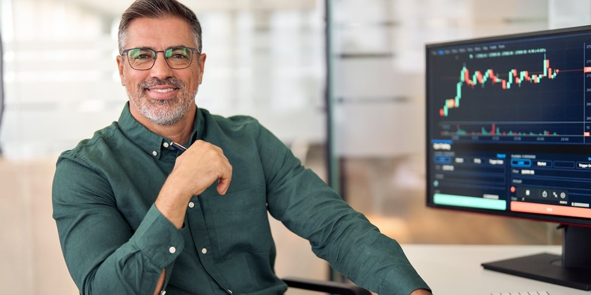 An accredited investor sitting at his desk