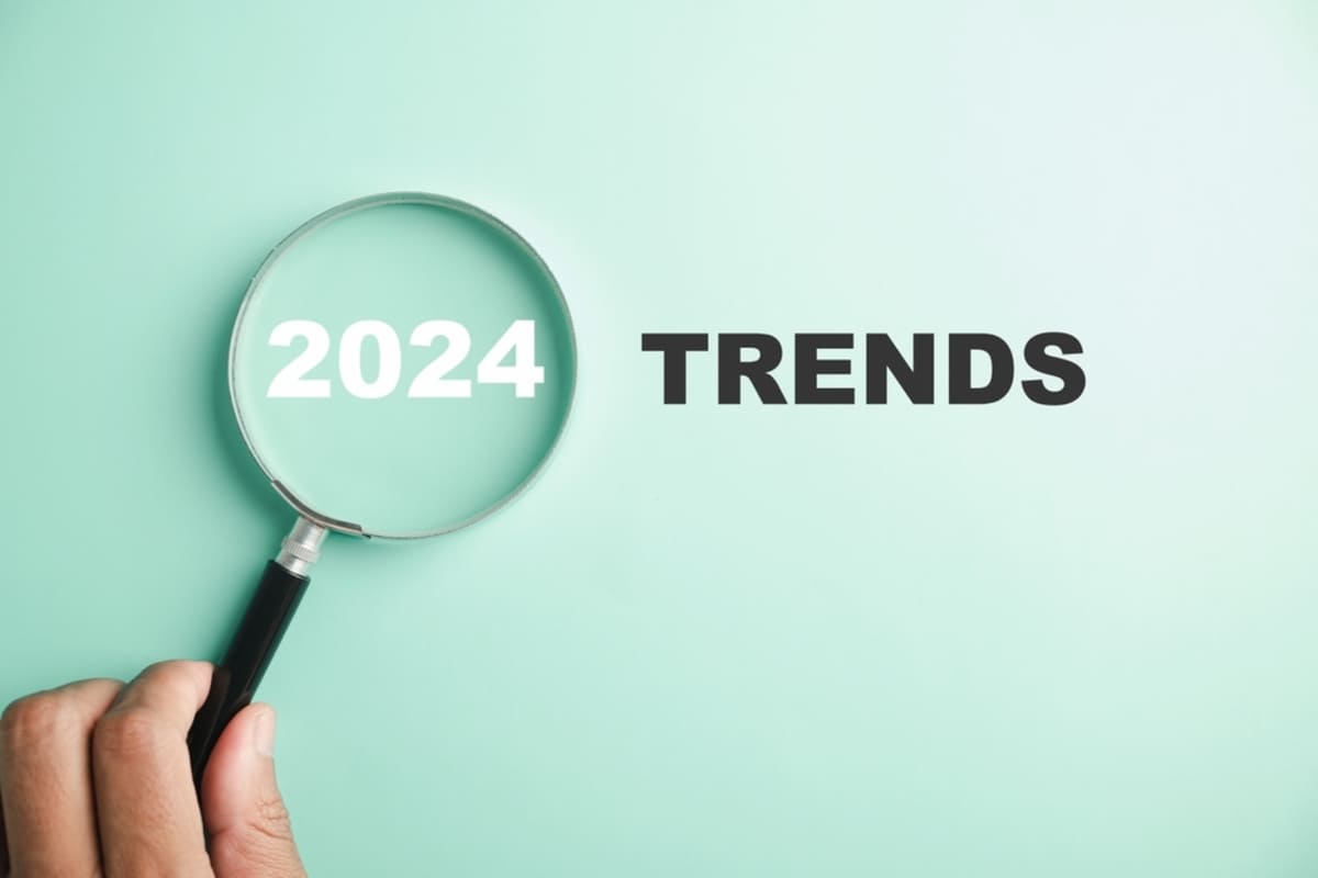 The words 2024 Trends over a green background with a magnifying glass