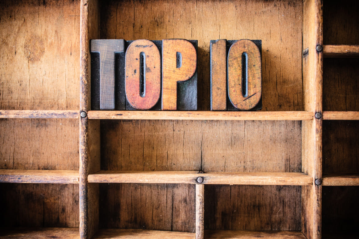 Wooden letters that spell out top 10 on wooden shelves