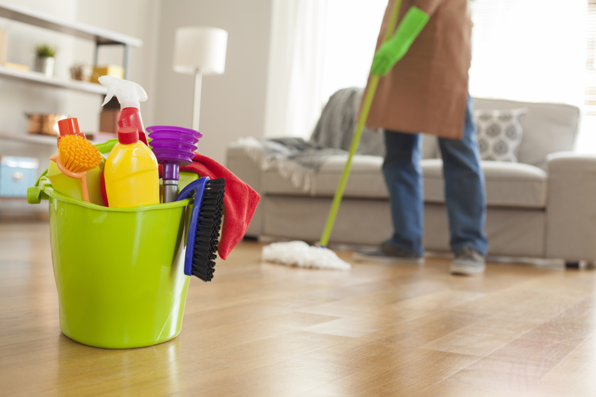 Professional cleaner mopping the floor