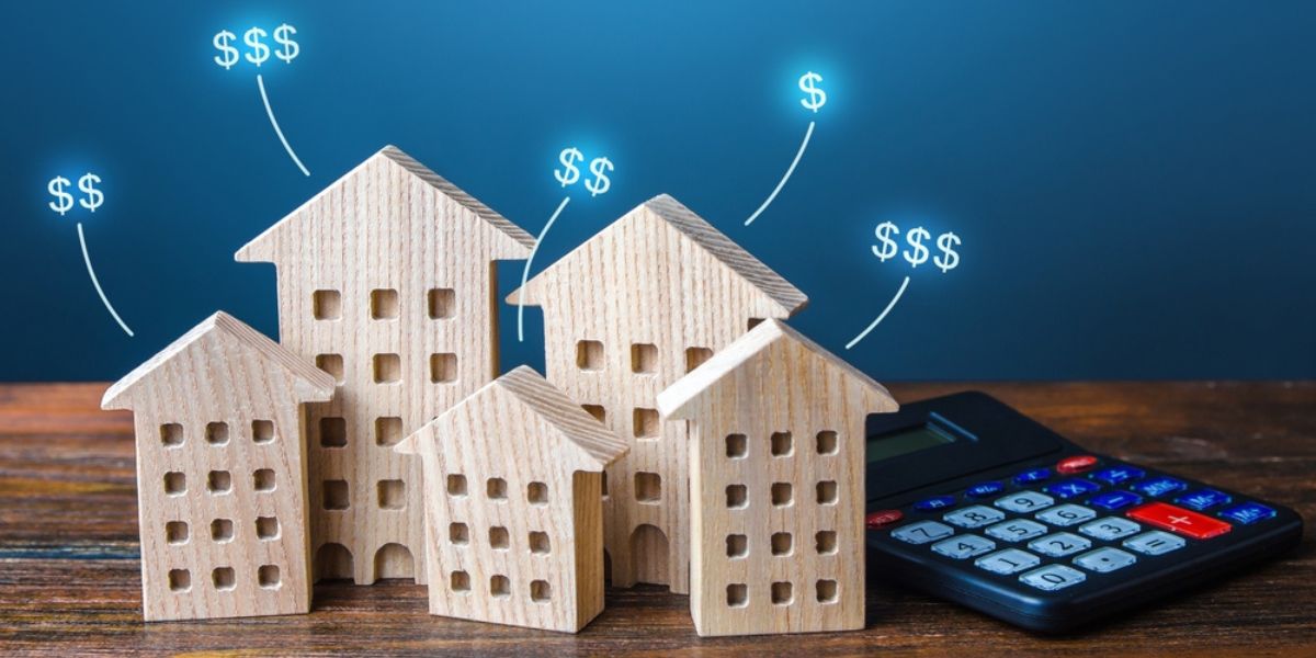 Residential buildings with dollar prices and calculator