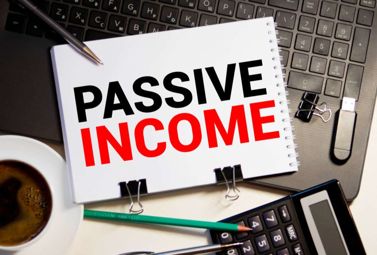 Passive Income on a notebook, passive real estate investing concept